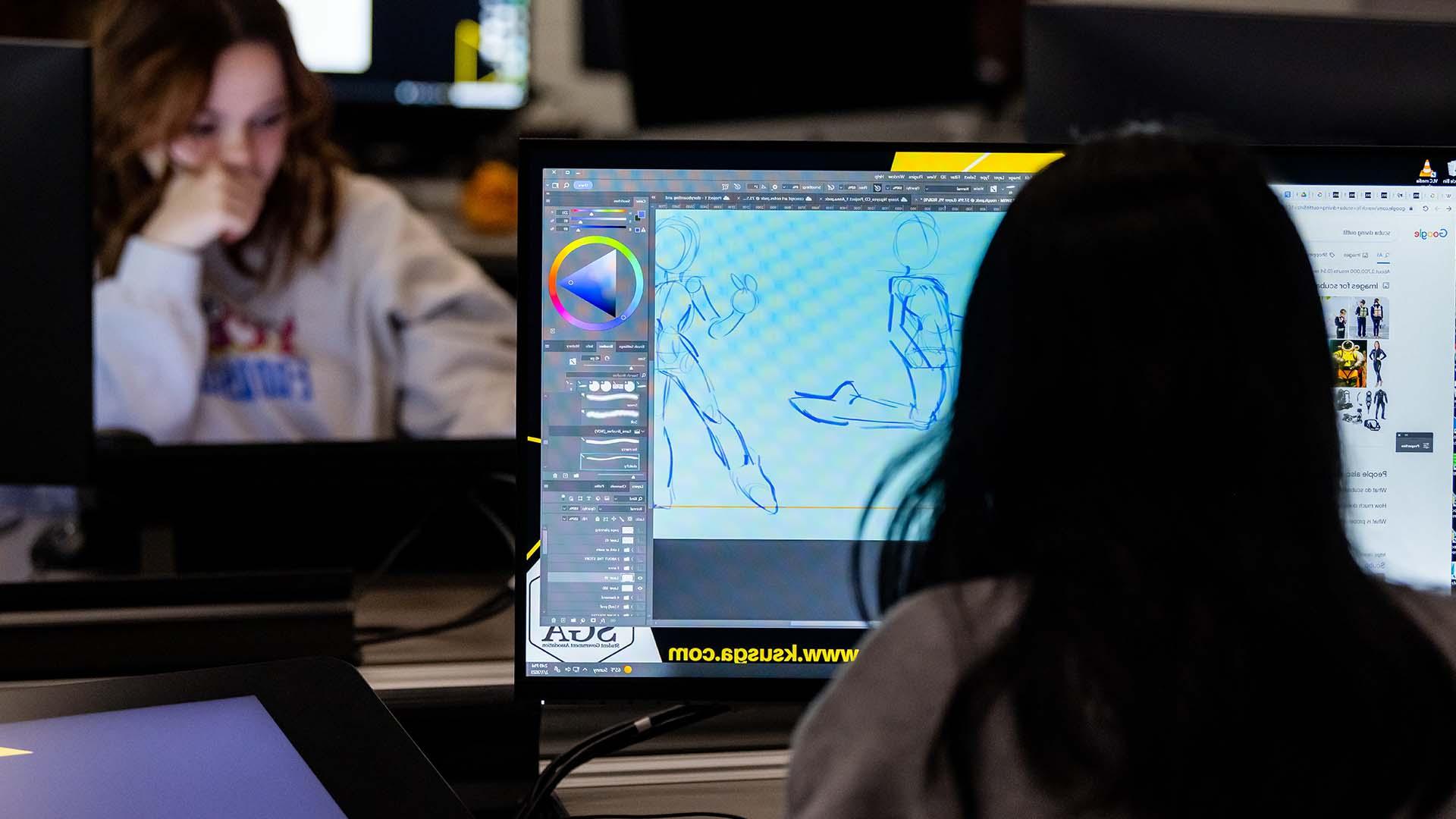  /在计算机实验室从事角色设计的动画专业学生. 