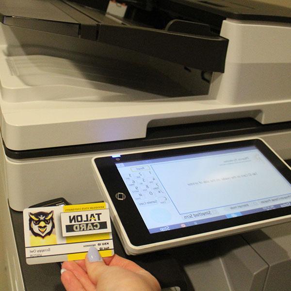 Student using their Talon Card to print on campus